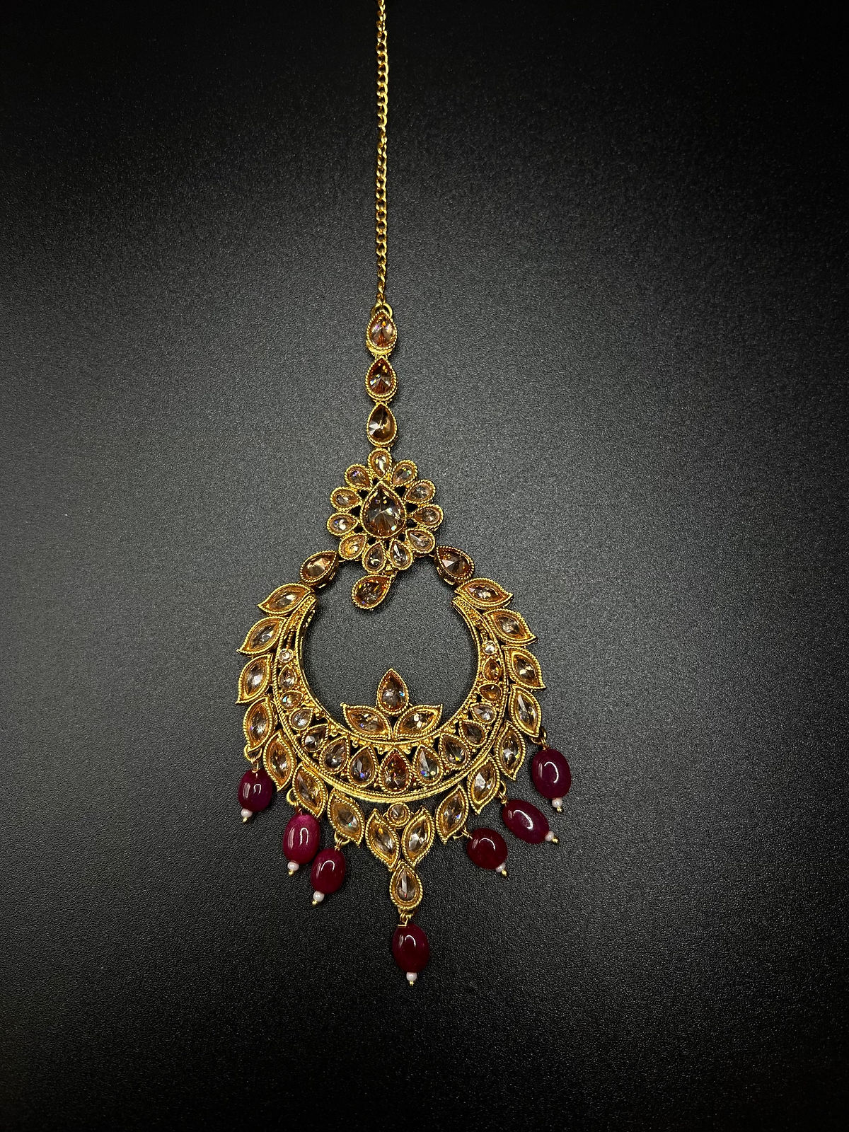 Gold and maroon maang Tika 